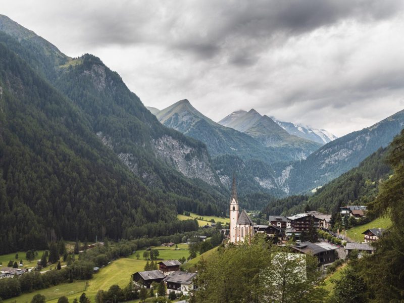 A beautiful shot of a small valley community with the famous Saint Vincent Church in Heiligenblut, Karnten, Austria